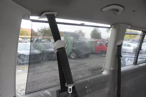 VW T5 Caravelle Rollo Sonnenschutz Sonnenrollo grau ganz hinten links 